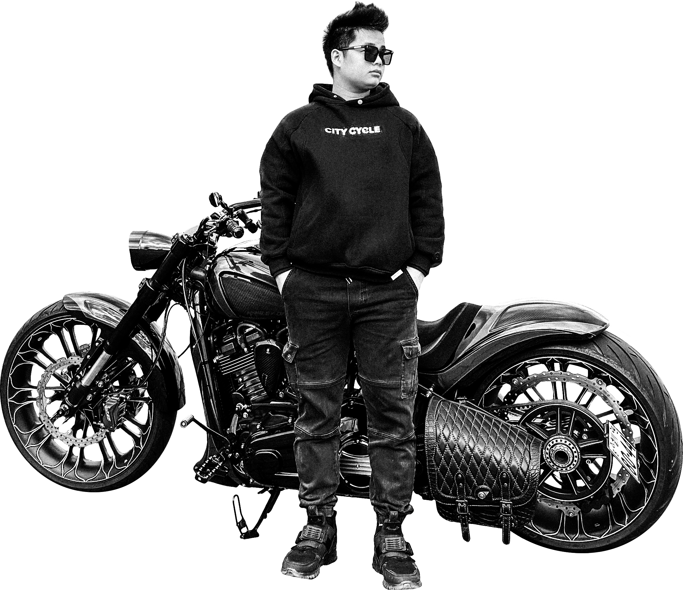 Leo Tùng standing beside his motorcycle in a black-and-white photograph